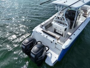 Blackfin 27-foot center console boat with a guest onboard, cruising off the coast of Miami.